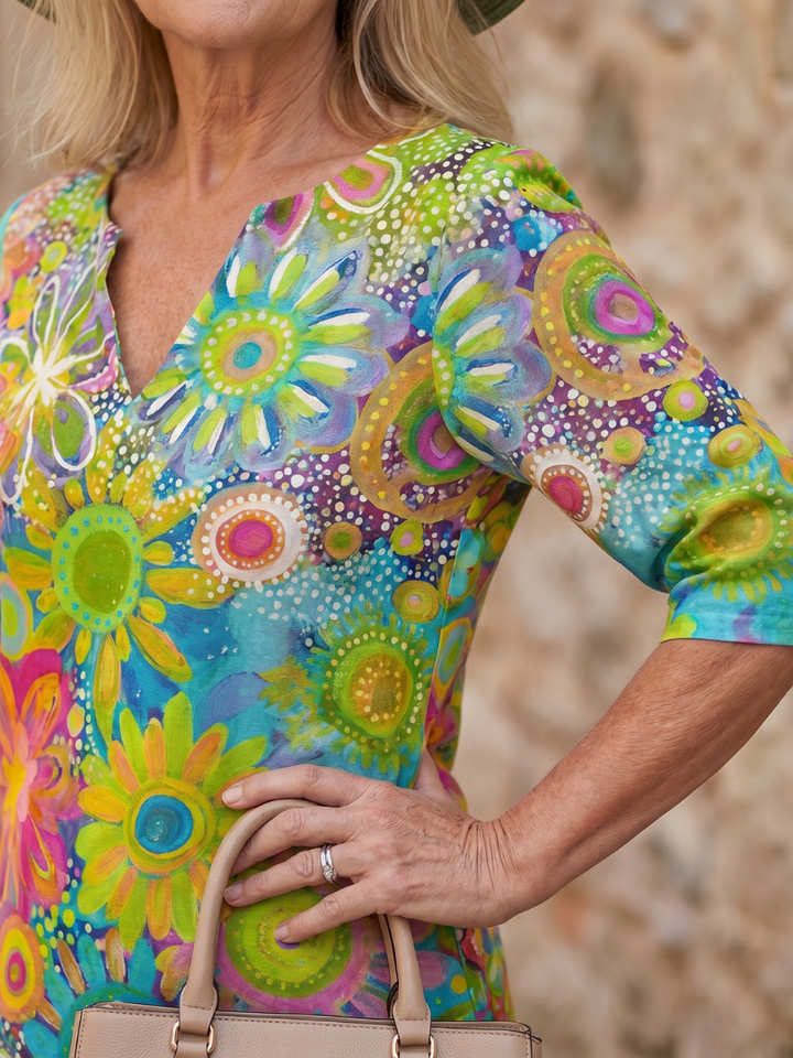 Everyday women's knee-length dress with a cheerful multicolor floral pattern and relaxed fit.