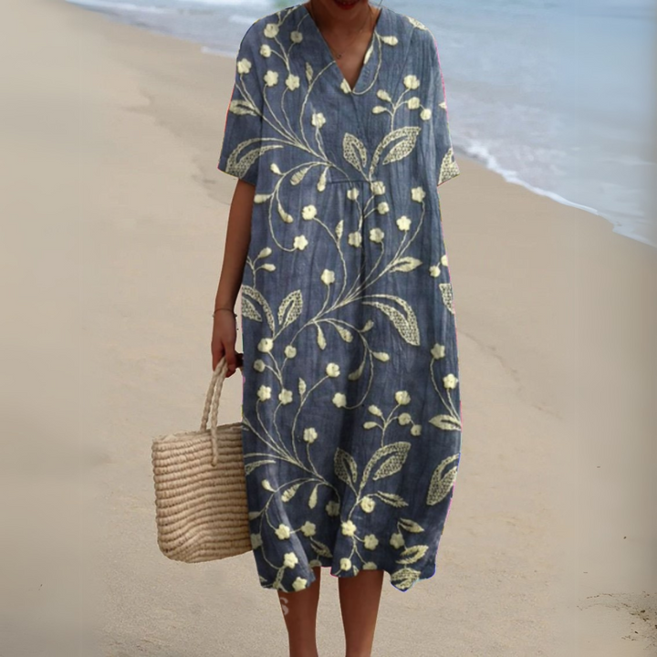 Ladies' elegant summer midi dress, multicolour and flowy, perfect for a vacation look.