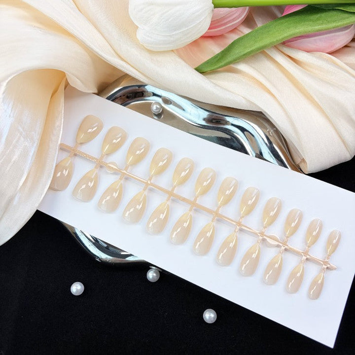 Effortless style with women's natural glossy press-on nails. Instant fake nails offering a perfect, natural finish.