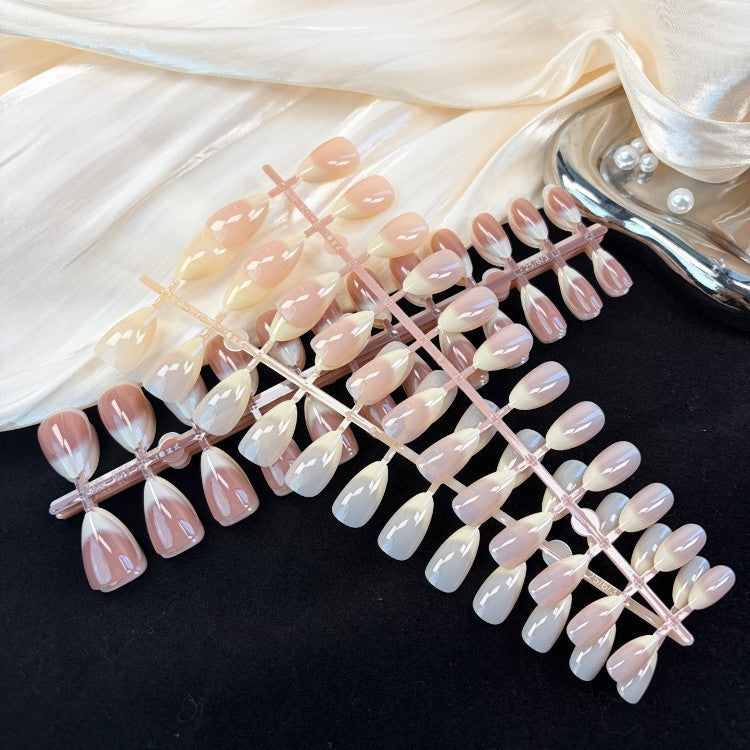 Complete women's press-on nail kit. Natural glossy artificial nails for a salon-quality, instant manicure.