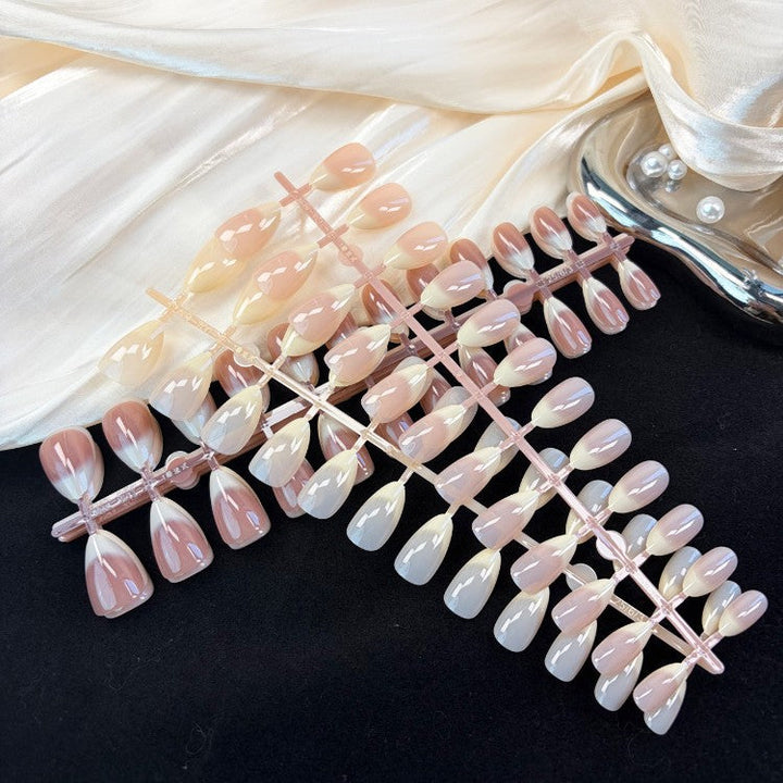 Complete women's press-on nail kit. Natural glossy artificial nails for a salon-quality, instant manicure.