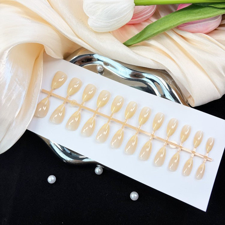 Women's natural glossy press-on nail set, a stylish beauty accessory for quick & easy instant manicures. Natural finish.