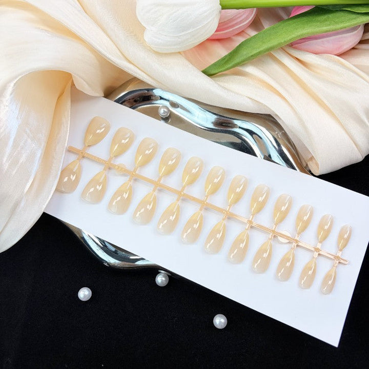 Women's natural glossy press-on nail set, a stylish beauty accessory for quick & easy instant manicures. Natural finish.