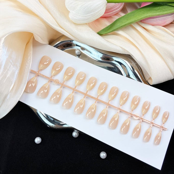 Versatile natural glossy press-on nails for women. Instant fake nails offering everyday elegance & a perfect finish.
