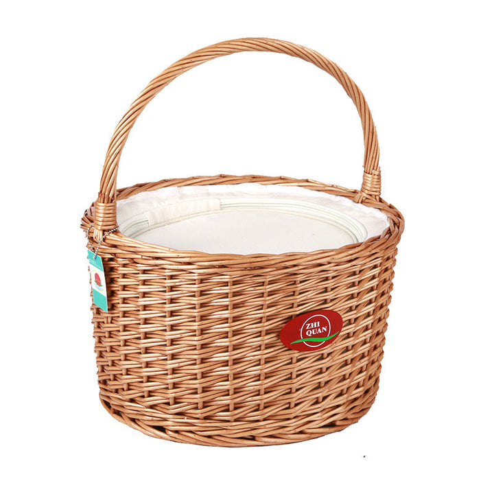 Stylish women's natural woven picnic basket, brown & white, solid wooden lid for elegant outdoor gatherings.