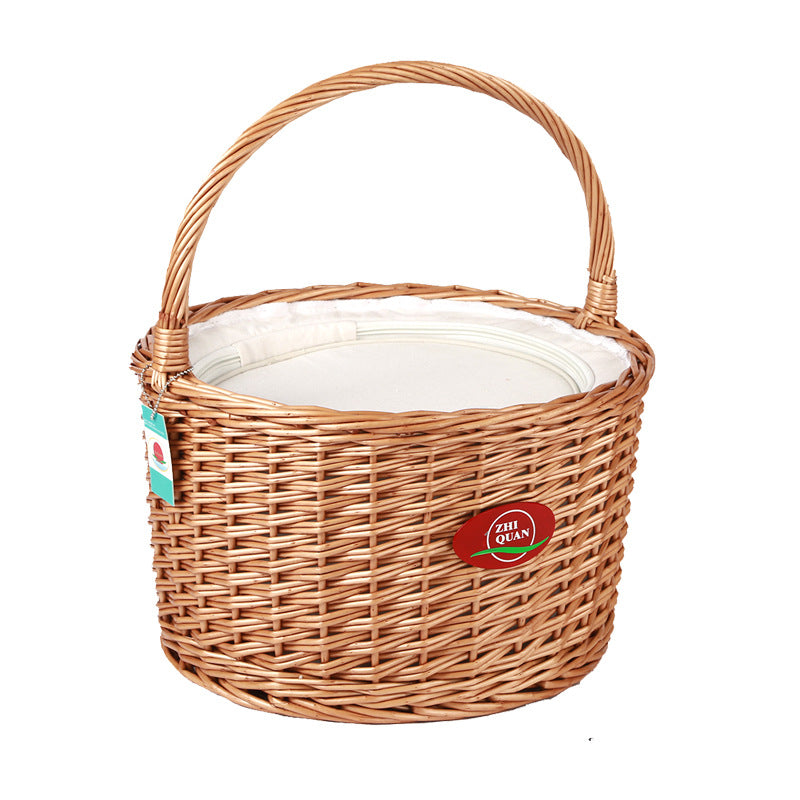 Portable natural woven picnic basket for women, with secure wooden lid, perfect for outdoor adventures & picnics.