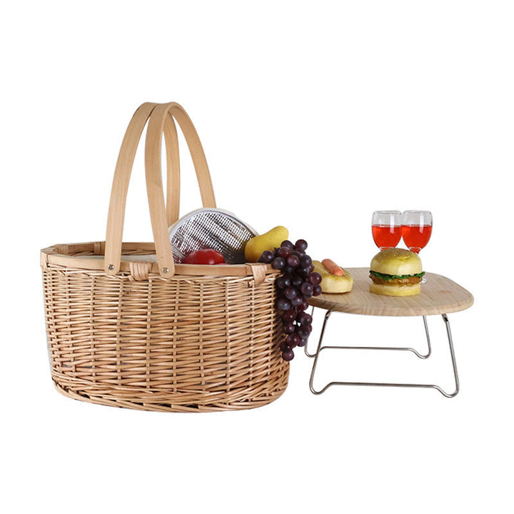 Classic women's natural woven oval picnic basket, sturdy wooden lid, brown & white, perfect for outdoor park use.