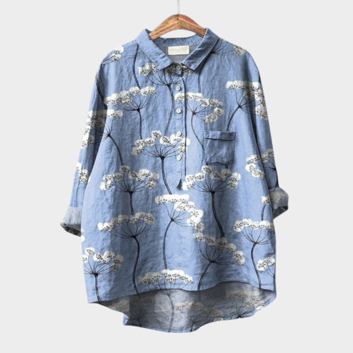 Women's Nola Blouse with artistic nature prints, a long sleeve feminine top for versatile fashion.