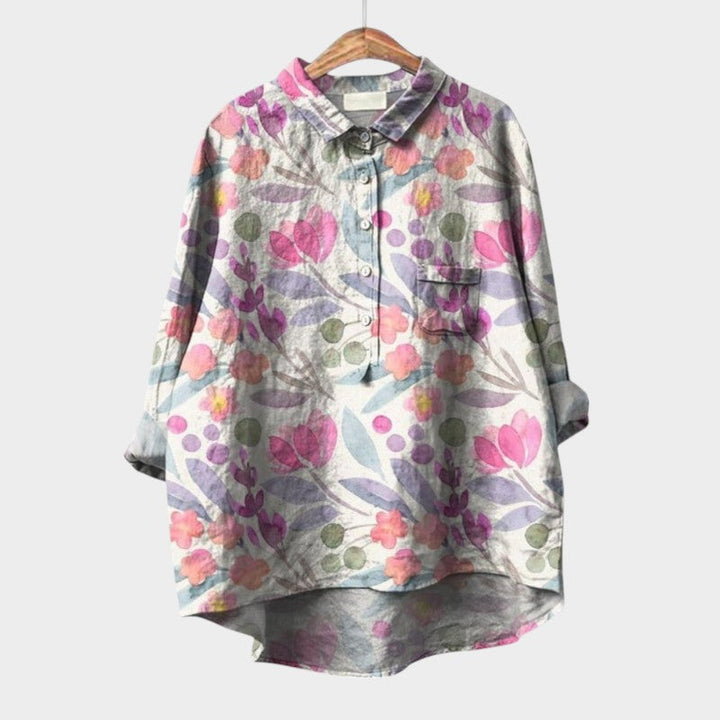 Elegant women's blouse featuring artistic nature-inspired floral prints, perfect for casual or refined wear.