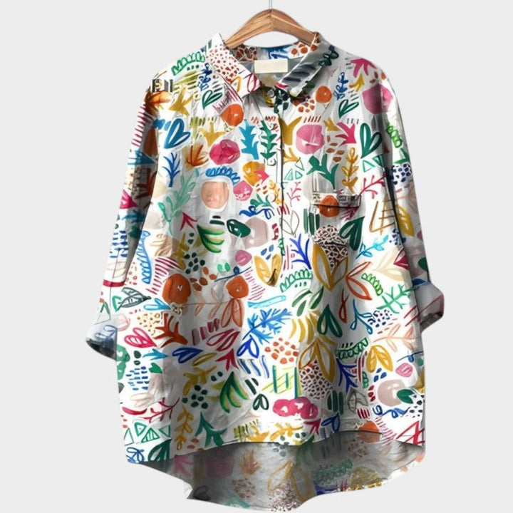 Stylish Nola women's long sleeve top with unique nature prints, a versatile and feminine boutique blouse.