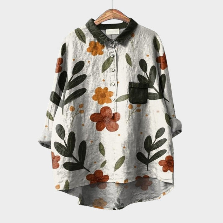 Feminine floral top: long sleeve women's Nola blouse with vibrant artistic nature prints, elegant and chic.