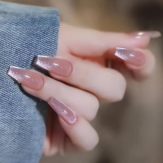 Glamorous nude pink cat eye press-on nails for women, featuring a beautiful glitter finish; quick & stylish fake nails.