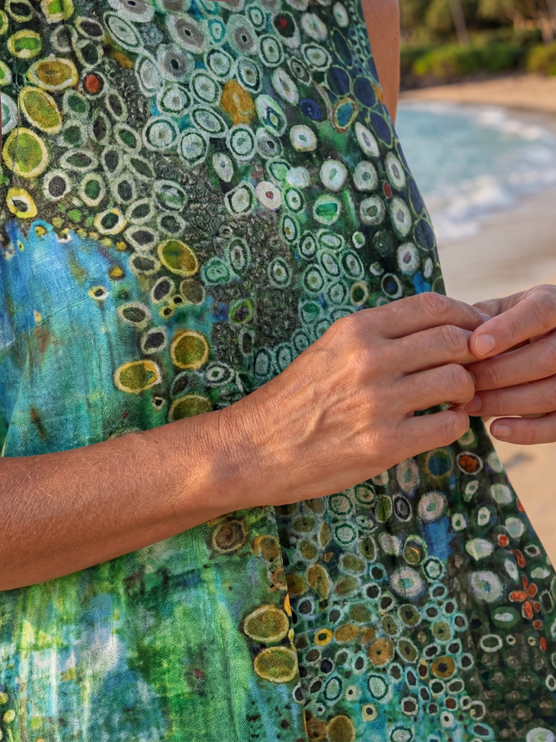 Sleeveless Women's green midi dress featuring an abstract Ocean Mosaic pattern. Ideal for casual summer events.