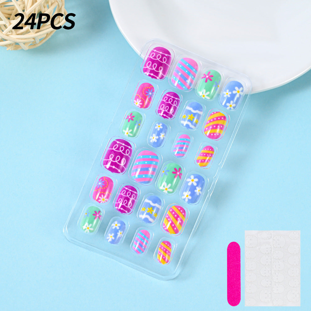 Quick manicure press-on nails, summer ready with vibrant ocean blue and white beach-themed designs.