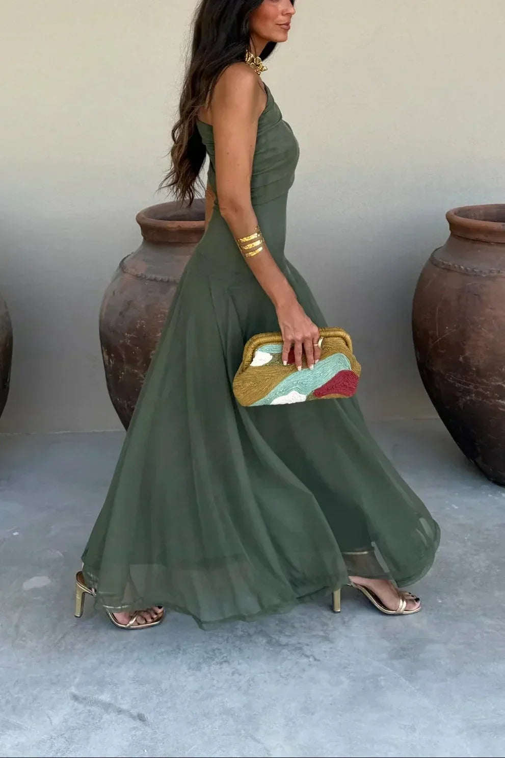 Captivating women's off-shoulder evening gown, featuring a draped waist, ideal for special occasions.