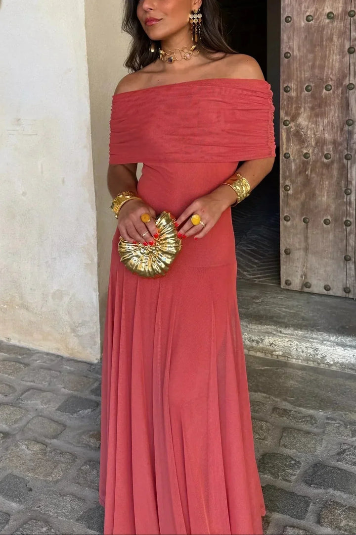 Beautiful women's off-shoulder maxi dress with a flattering draped waist, perfect as a wedding guest gown.