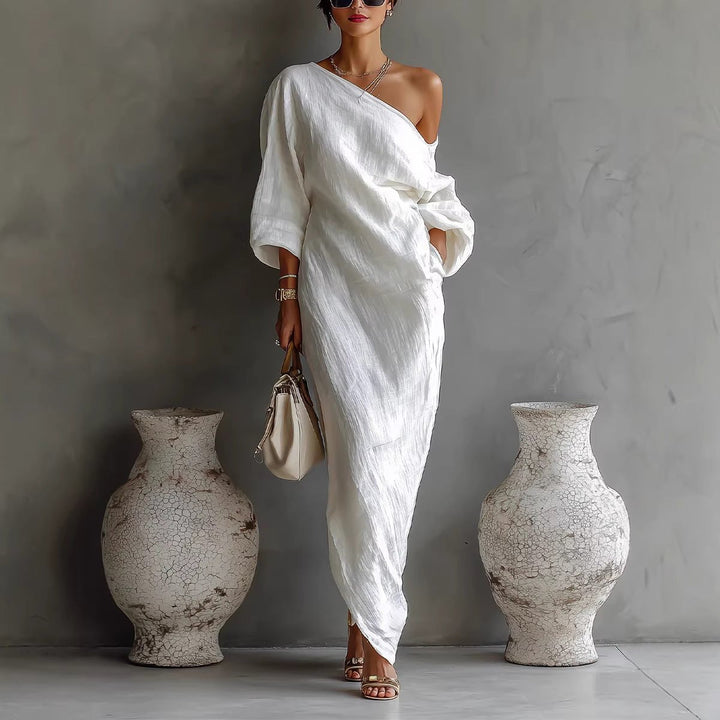 Flowing linen off-shoulder maxi dress for women, ideal for casual summer days, beach vacations, or elegant events.