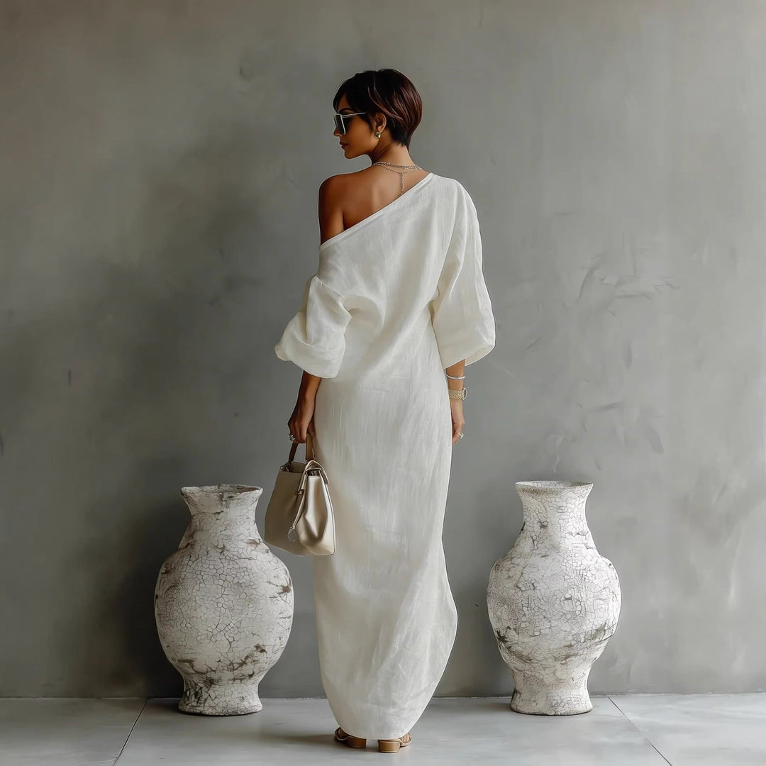 Elegant women's off-shoulder linen maxi dress, featuring voluminous lantern sleeves and a relaxed, flowing silhouette.