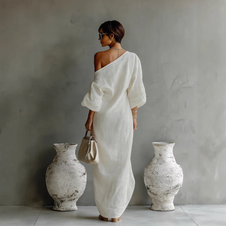Elegant women's off-shoulder linen maxi dress, featuring voluminous lantern sleeves and a relaxed, flowing silhouette.