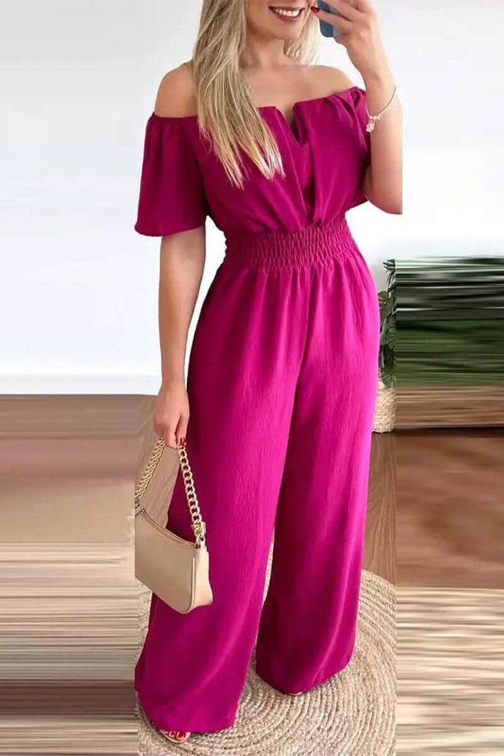Elegant women's off-shoulder short sleeve jumpsuit, perfect for a comfortable yet fashionable look. Black color.