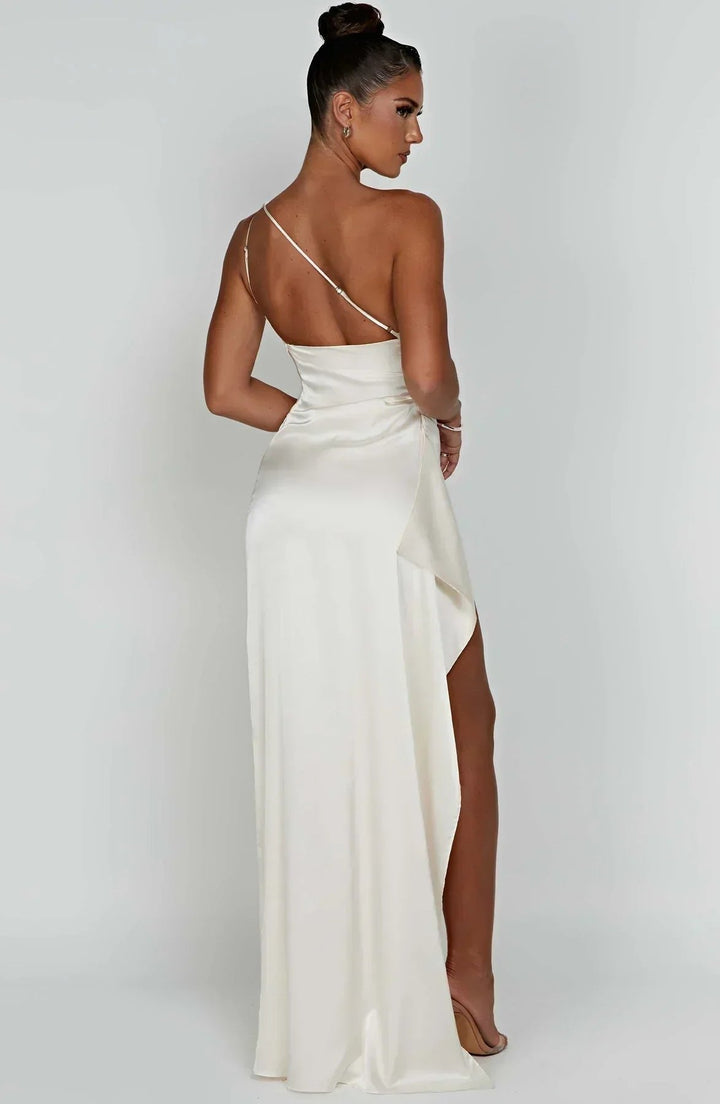 Elegant one-shoulder asymmetric maxi evening dress for women with high split. Formal occasion wear.
