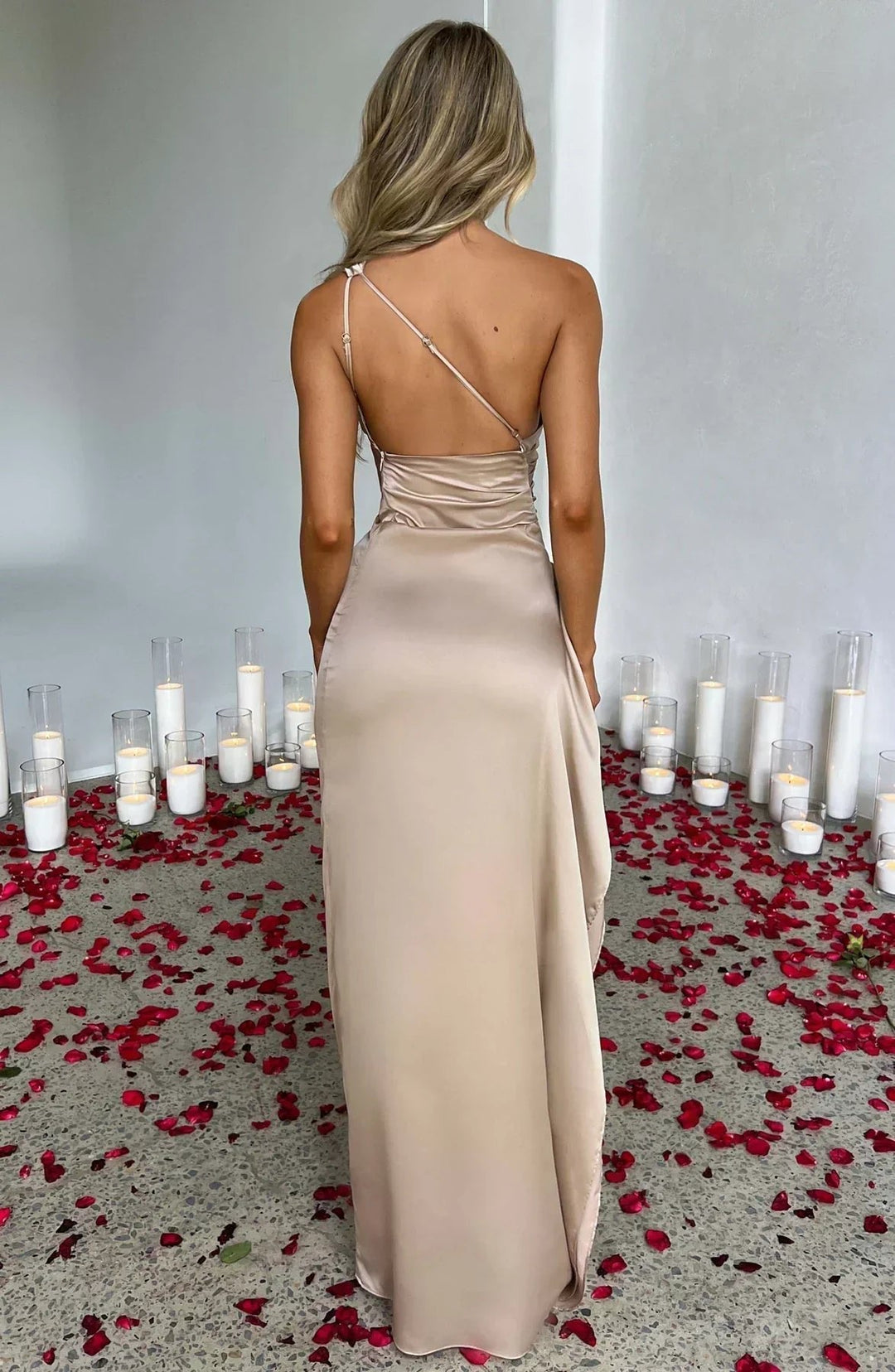 Sophisticated women's asymmetric one-shoulder maxi dress with high split, ruched detail. Formal evening wear.