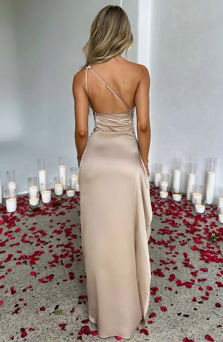 Sophisticated women's asymmetric one-shoulder maxi dress with high split, ruched detail. Formal evening wear.