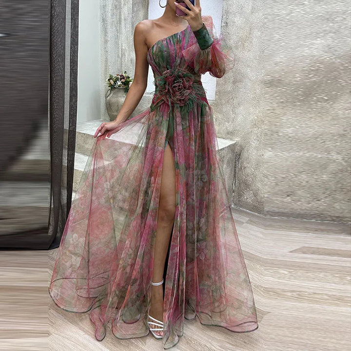 Flowy one-shoulder maxi gown with elegant floral print, ideal for a formal event or evening wear. Dreamy design.