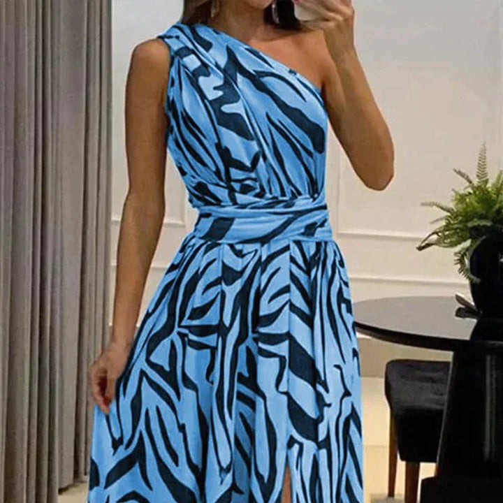Stylish zebra print one-shoulder maxi dress for women. Perfect party, evening or vacation style. Black & white fashion.