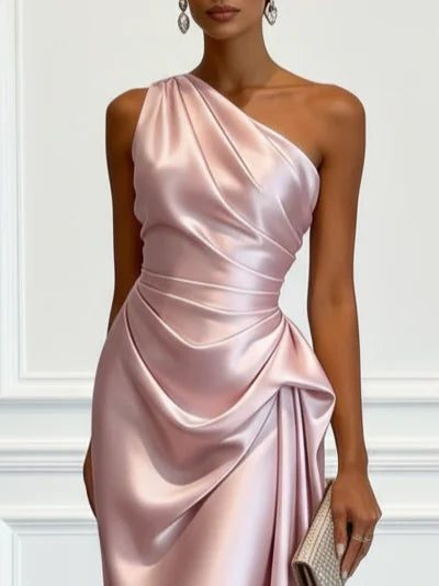 Stylish women's wedding guest attire: a ruched one-shoulder midi dress, perfect for a chic party look.