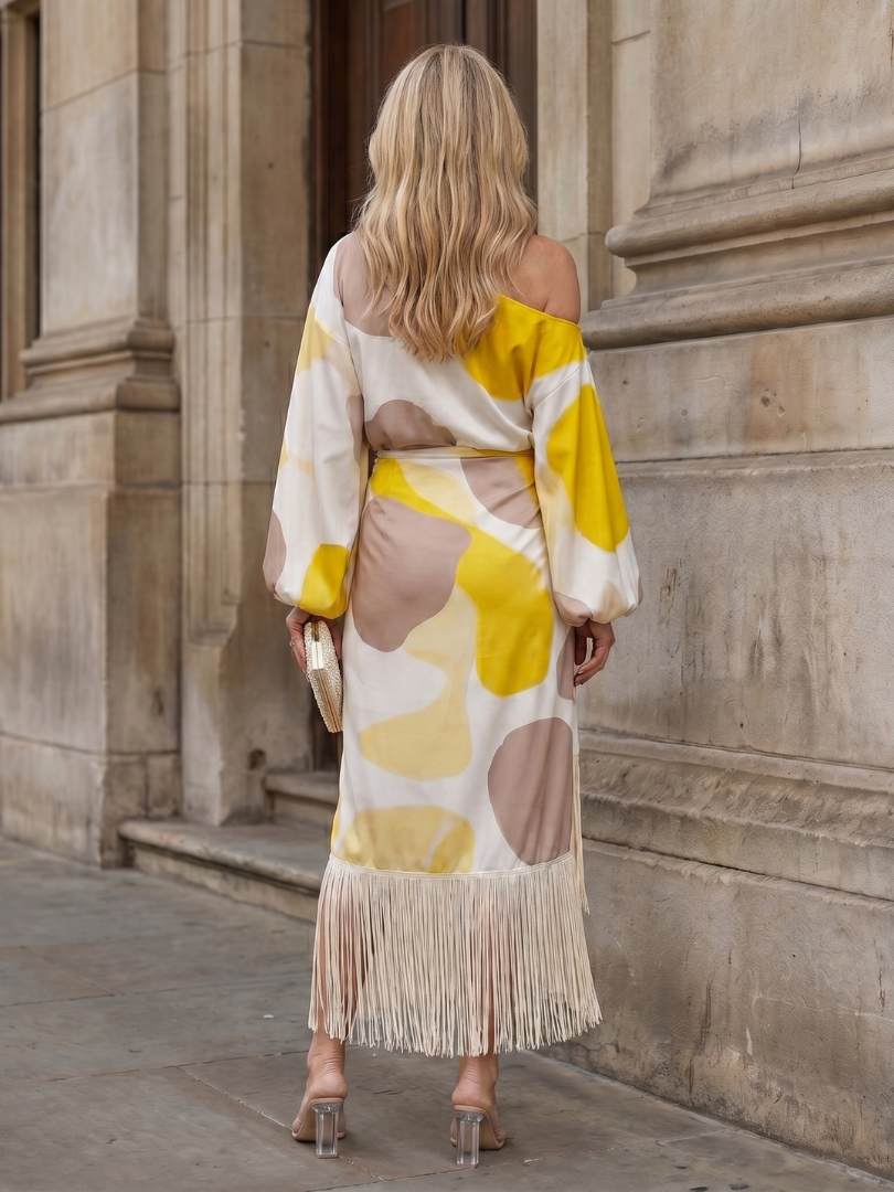 Stylish women's one-shoulder wrap midi dress, featuring a unique fringe hem detail & bishop sleeve.