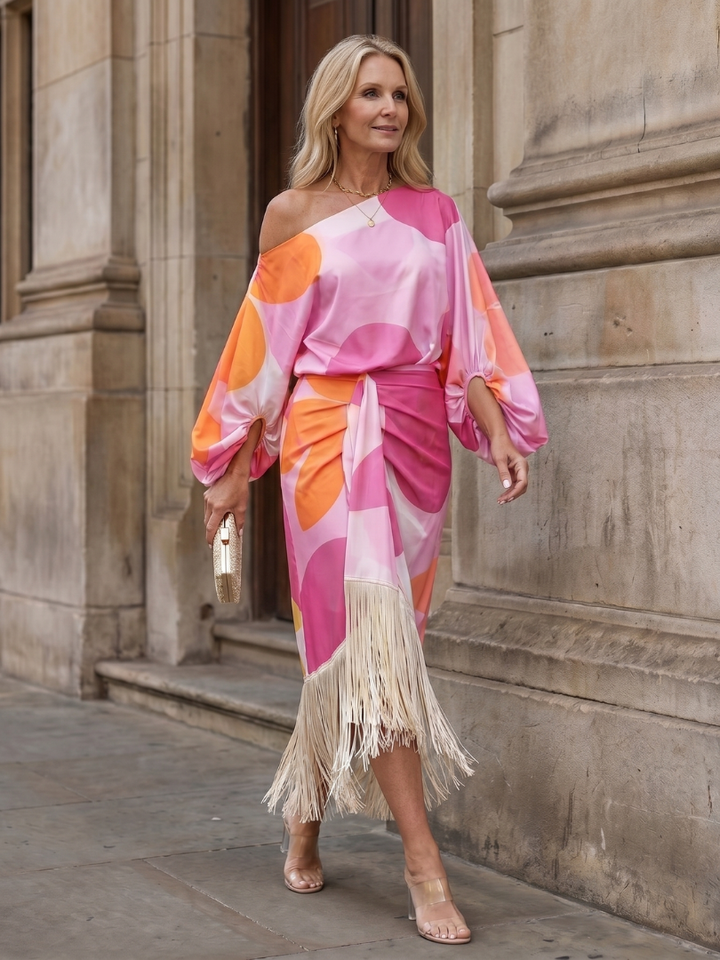 Sophisticated women's party midi dress with a one-shoulder design, wrap front & playful fringe hem.