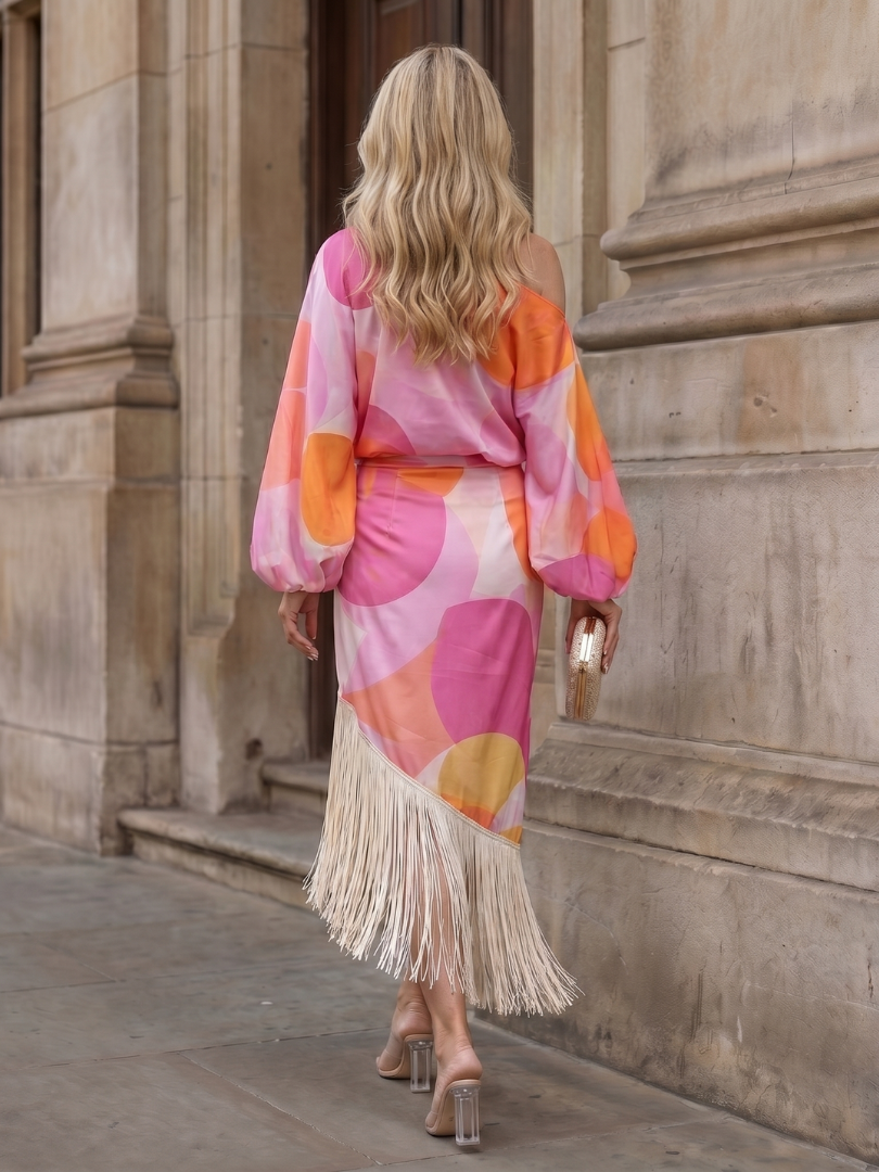 Women's elegant one-shoulder midi wrap dress, featuring a stylish fringe hem. Perfect for cocktails & formal events.