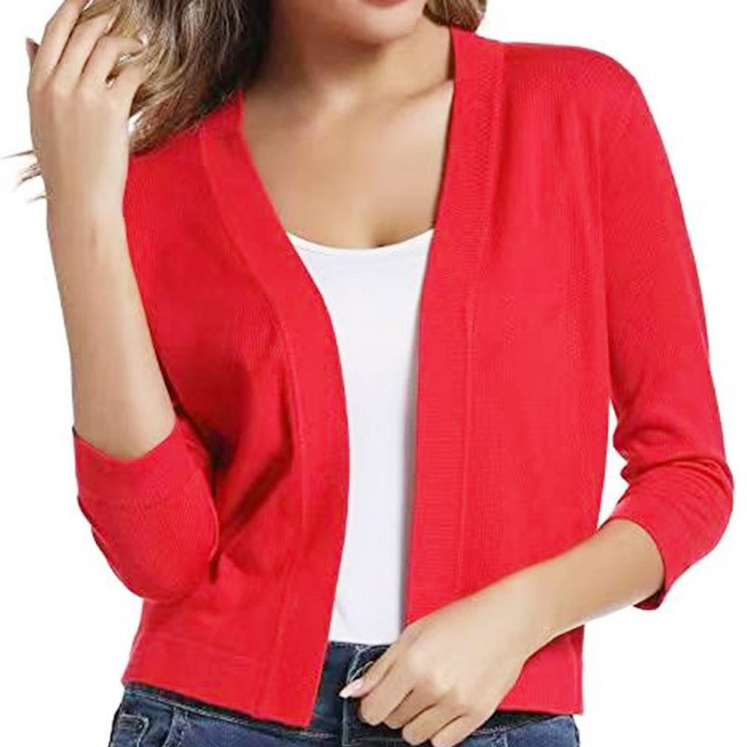 Graceful women's open-front cropped cardigan, 3/4 sleeves, for an elegant spring look.