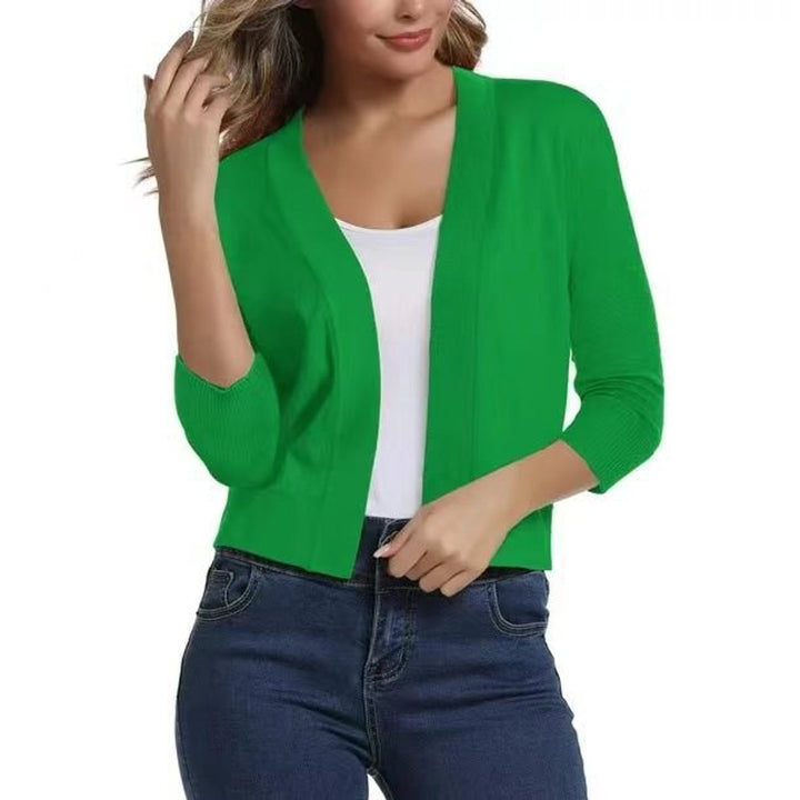 Chic women's cropped cardigan with 3/4 sleeves, perfect for spring fashion layering.