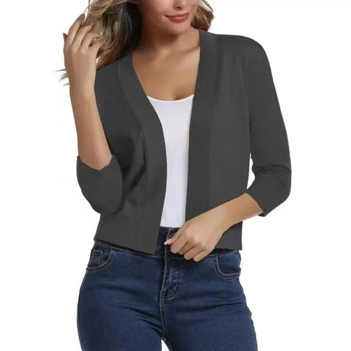 Stylish open-front women's cropped cardigan, three-quarter sleeves, ideal for office or casual.