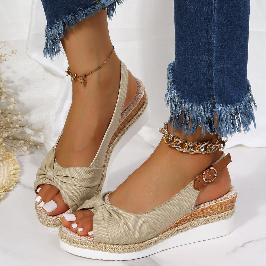 Fashionable women's open-toe wedge sandals, chic and comfortable, perfect for any summer outfit.