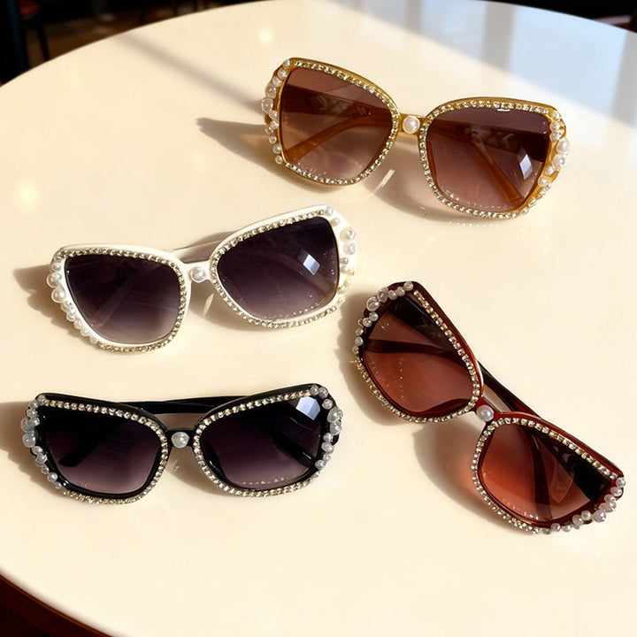 Embellished cat-eye sunglasses for women, featuring ornate details & a chic retro design for fashion-forward style.