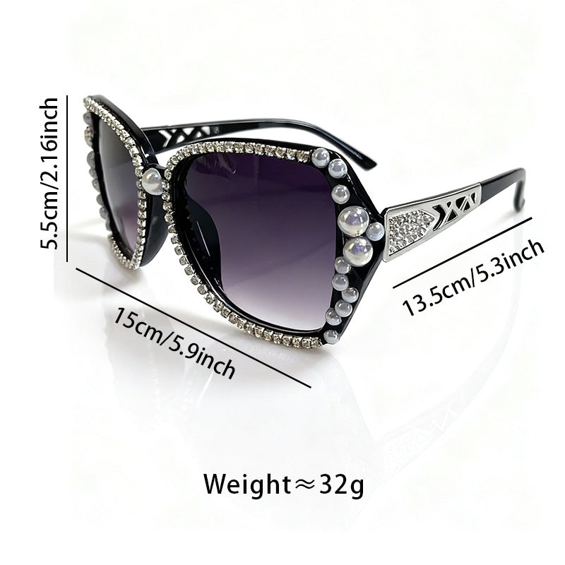 Glamorous women's cat-eye sunglasses with ornate embellishments, perfect for statement fashion & sun protection.