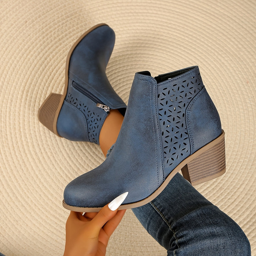 Supportive women's boots with a stylish laser-cut design, ideal for casual wear.