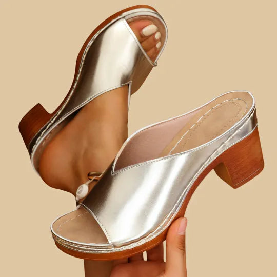 Durable women's orthopaedic sandals feature a chunky heel, ensuring stability and comfortable arch support.