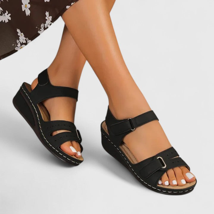 Cushioned women's health sandals with adjustable straps, providing foot support & comfort for walking.