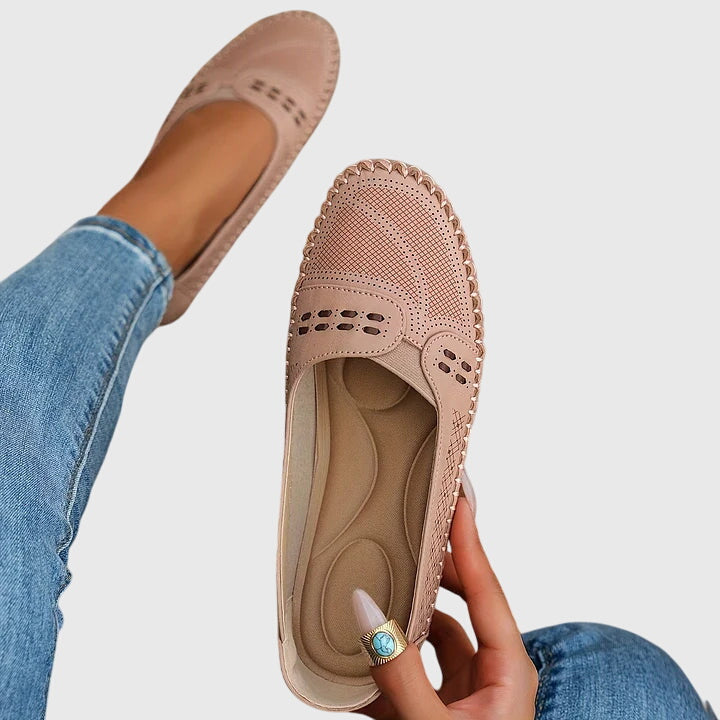 Pair of women's orthopaedic loafers, black, featuring easy slip-on design & superior comfort.