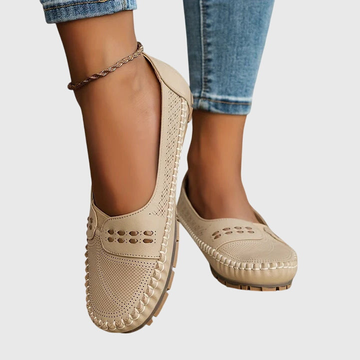 Side view of women's comfort loafers, highlighting ergonomic arch support for prolonged walking.