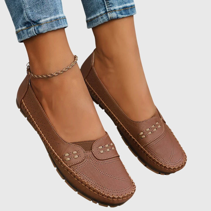 Top view of ladies' comfort footwear, brown orthopaedic loafers with slip-on convenience.