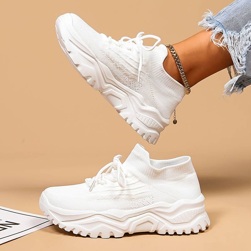 Stylish black women's orthopaedic sneakers with ergonomic design, providing superior arch support for daily wear.