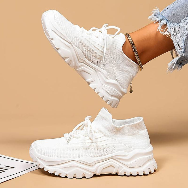 Stylish black women's orthopaedic sneakers with ergonomic design, providing superior arch support for daily wear.