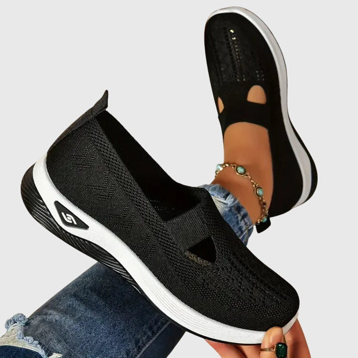 Women's orthopaedic walking shoes in black, designed for all-day comfort & foot support. Ideal for active lifestyles.