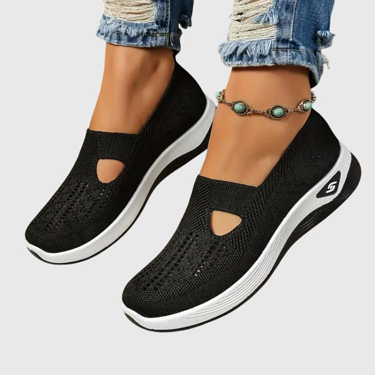 Side view of women's comfort shoes showcasing ergonomic design & arch support for an active, healthy walk.