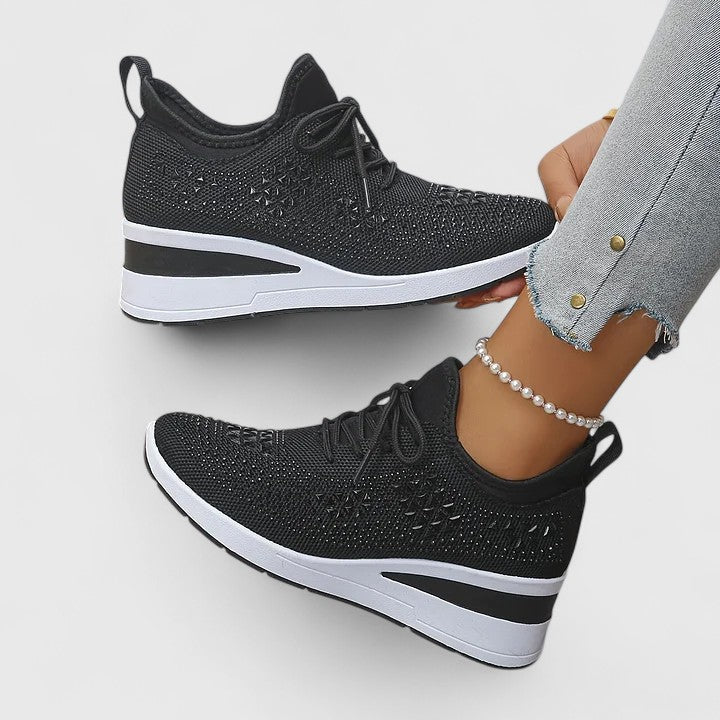 Close-up of women's orthopaedic walking shoes, highlighting arch support & sparkling detail.
